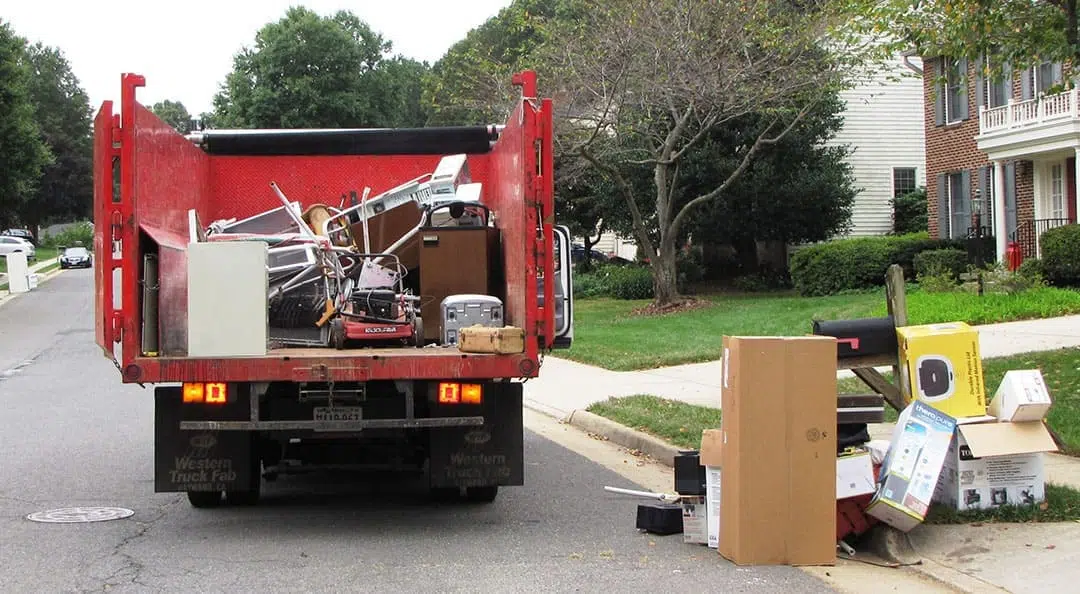 junk removal truck with old furniture