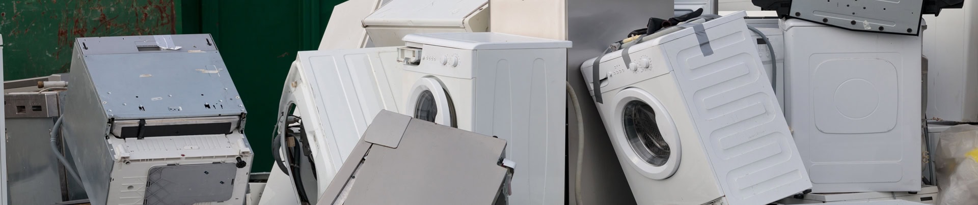 Scrapped washers, dryers and dishwashers stacked for metal recycling