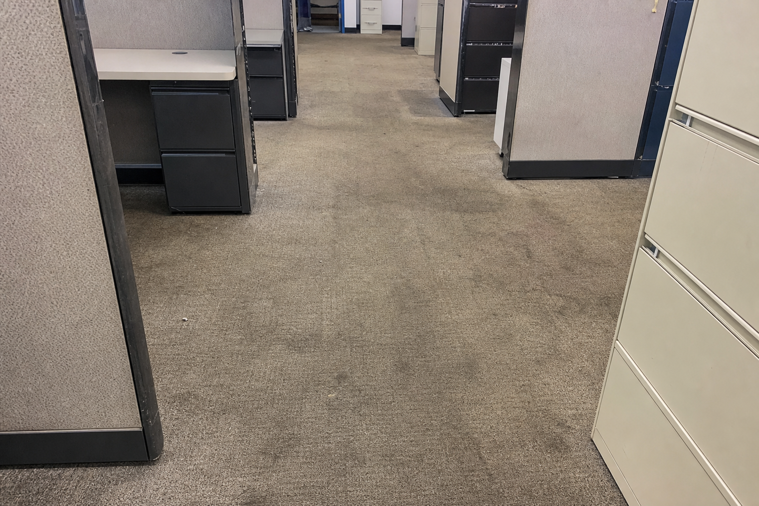 Worn office cubicle carpet ready for replacement and removal