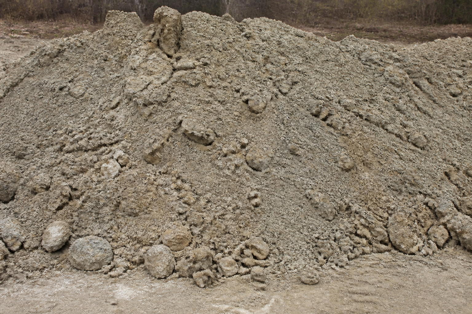 Pile of heavy clay fill dirt on bare ground