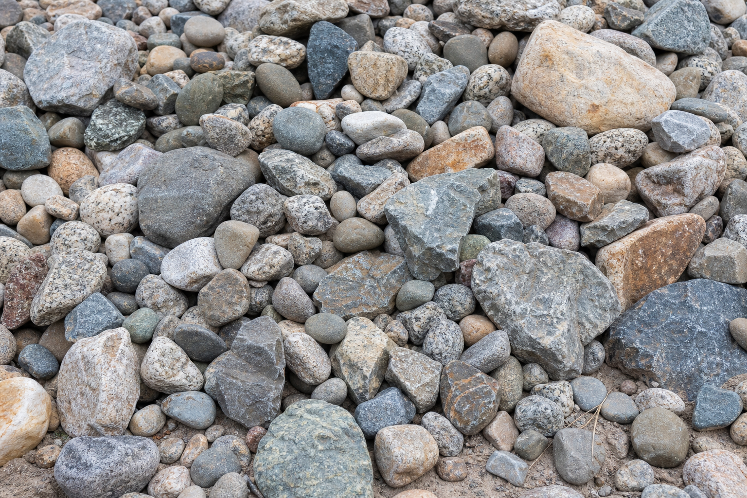 Pile of mixed landscaping gravel and decorative rock