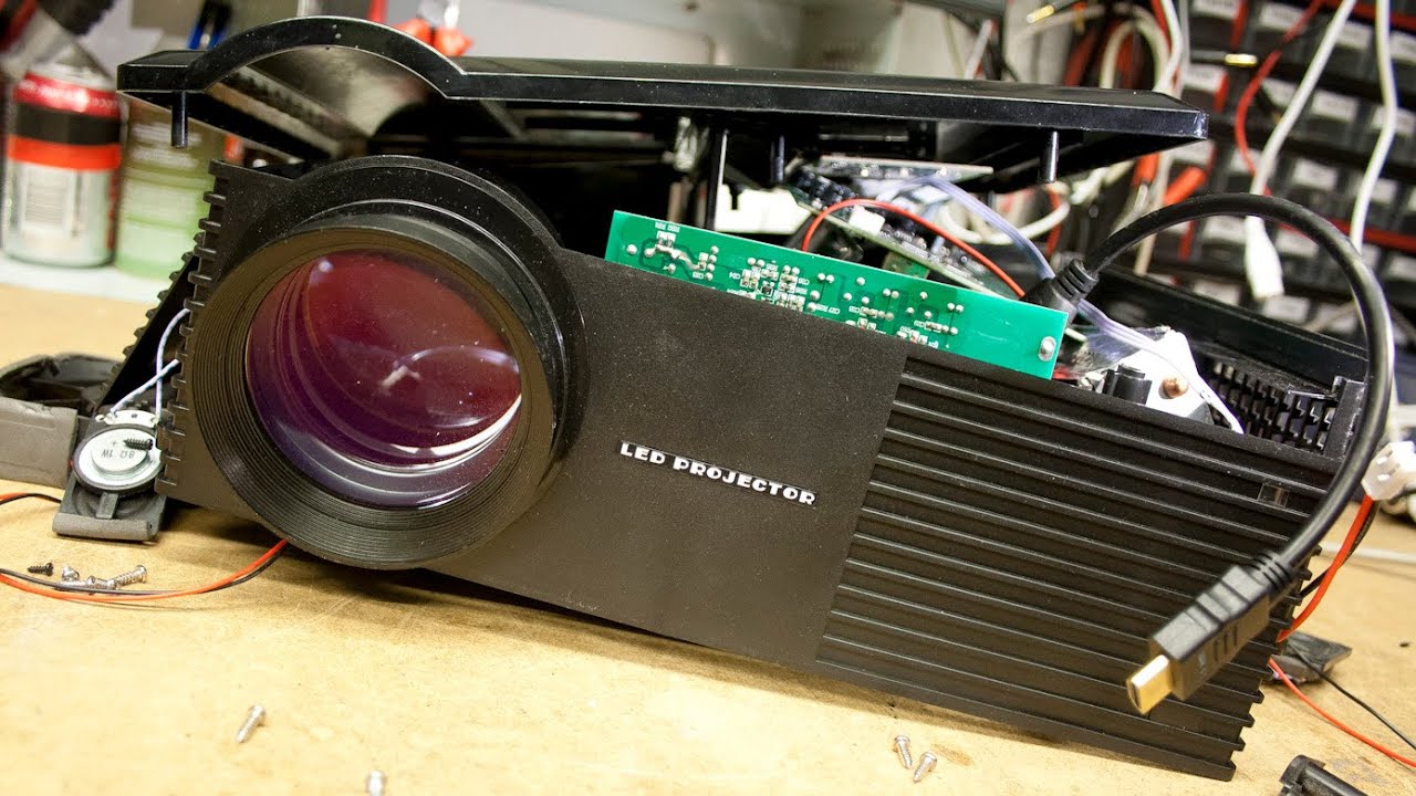 LED projector opened for its internal boards, staged for e-waste recycling
