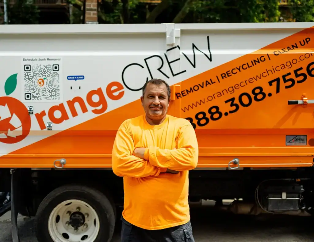 man standing near junk removal company truck