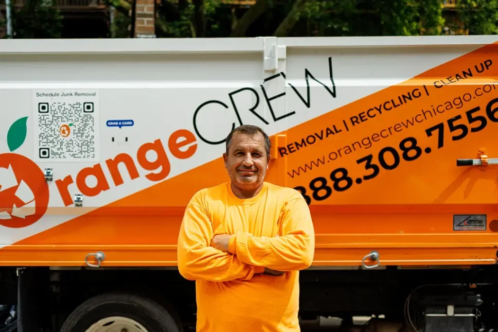 man standing near junk removal company truck