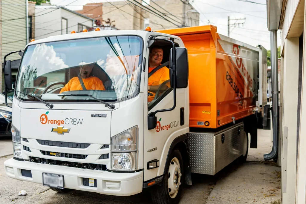two men in the junk truck