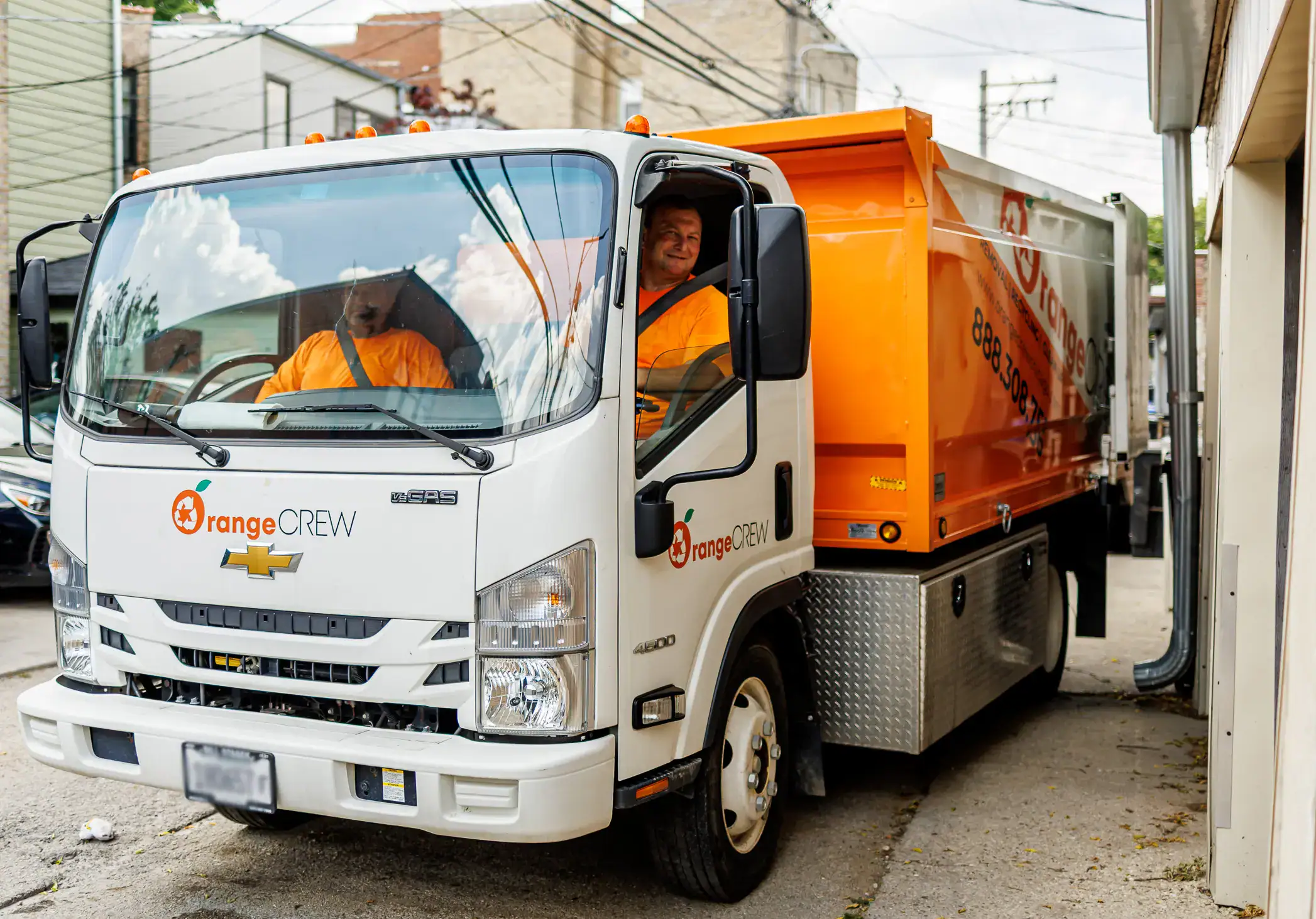 two men in the junk truck
